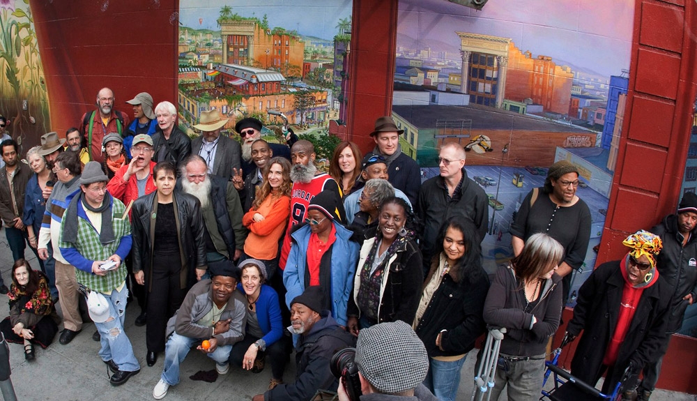 Neighborhood people at the Tenderloin mural by Mona Caron - photo by Moschiefphoto.com Neighborhood people at the Tenderloin mural by Mona Caron - photo by Moschiefphoto.com
