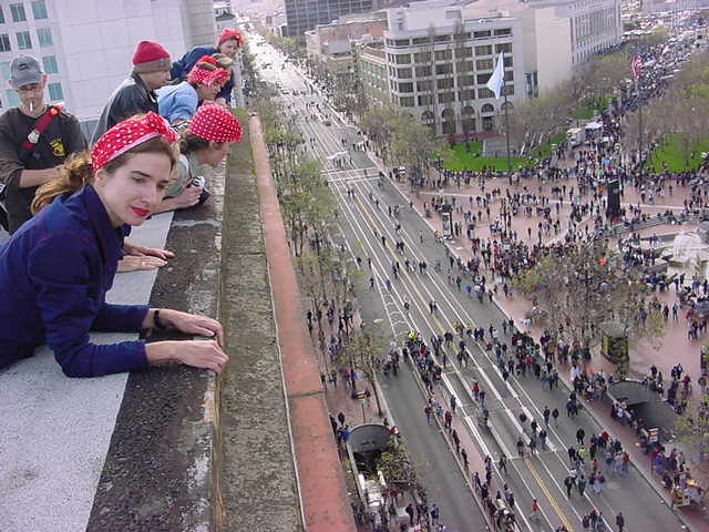 Rosie The Riveter gang, watching from the roof of the Grant Building